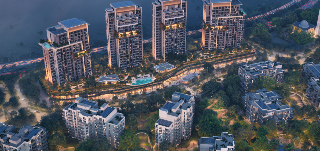 Aerial view of DISTRIKT at Ghaf Woods residential towers in green forest setting