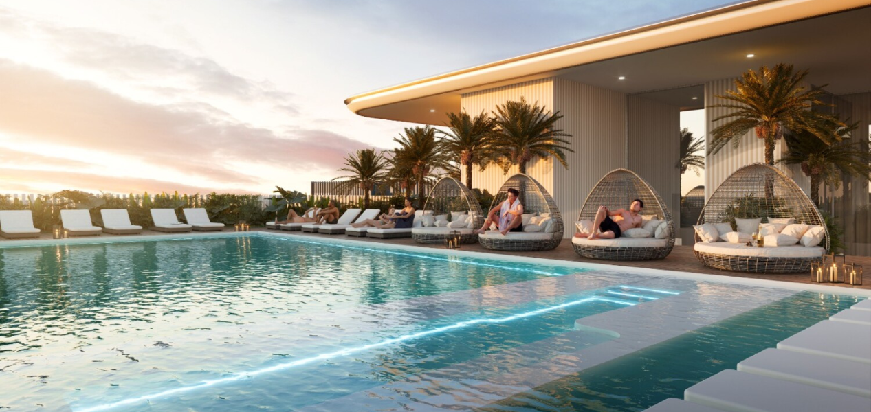 Sunset view of rooftop pool at Cove Edition 3 smart apartments in Dubailand