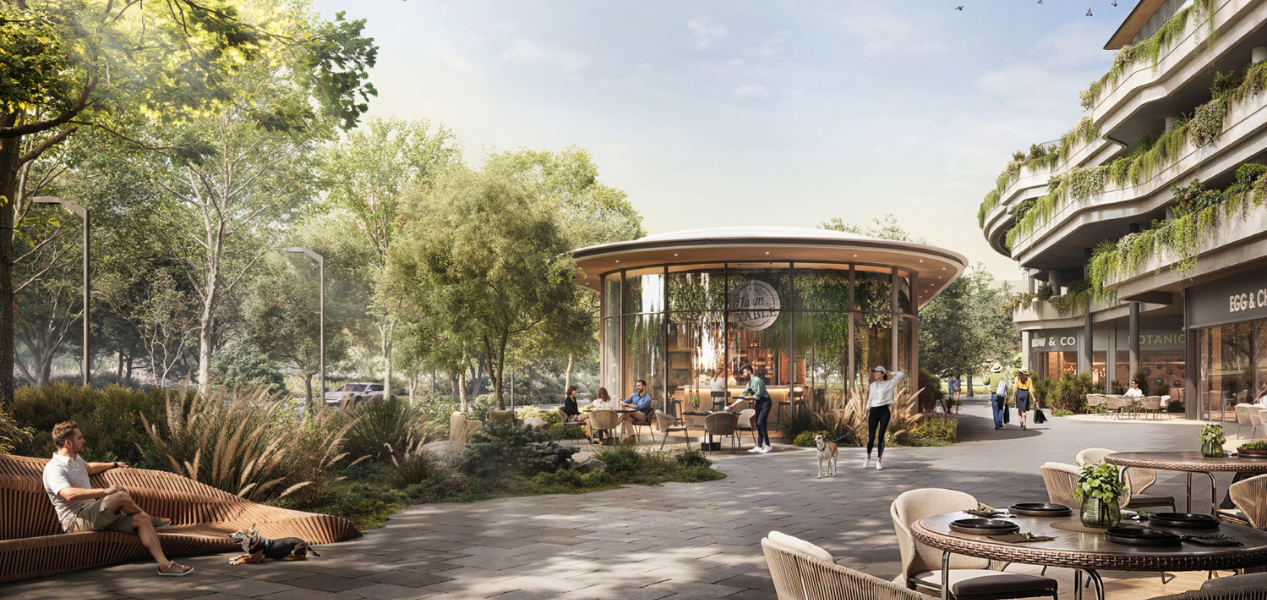 Community view of DISTRIKT at Ghaf Woods with cafes, greenery, and outdoor seating