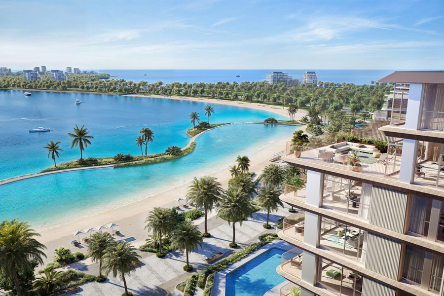 Infinity pool at Bay Grove Residences overlooking Dubai skyline during sunset
