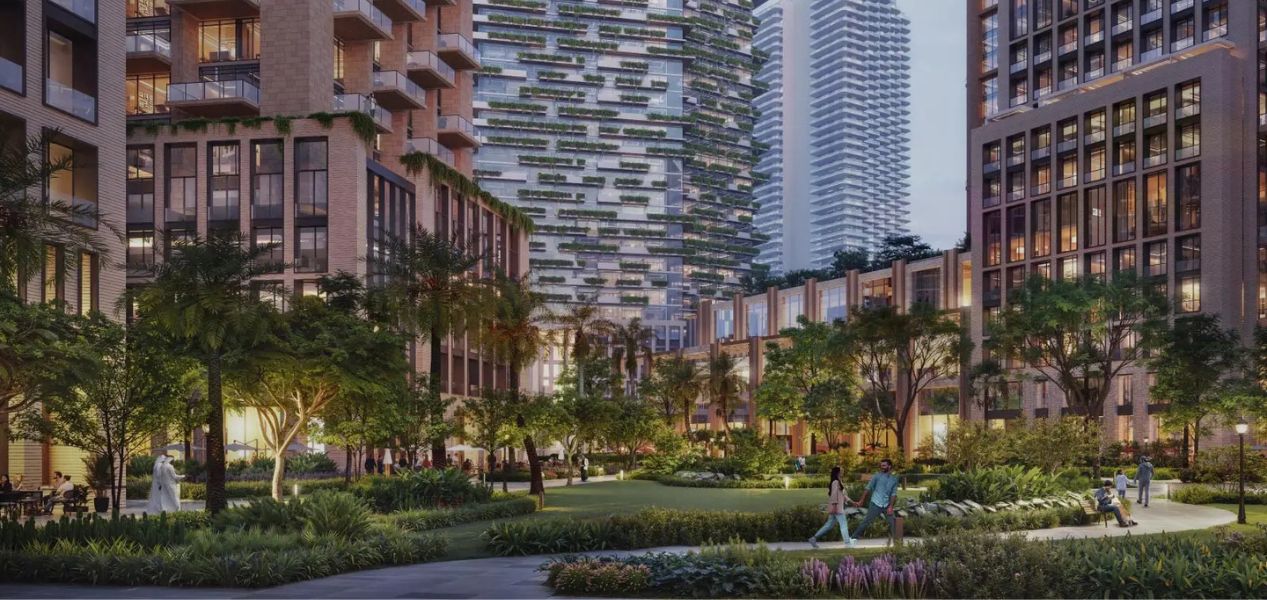 Azizi Milan apartments with green courtyard and waterfront promenade in City of Arabia