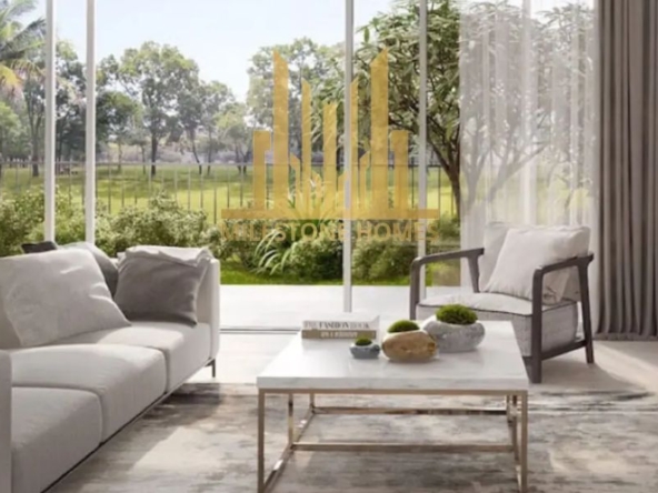 Bright living room with garden view at Camelia Villas Damac Hills