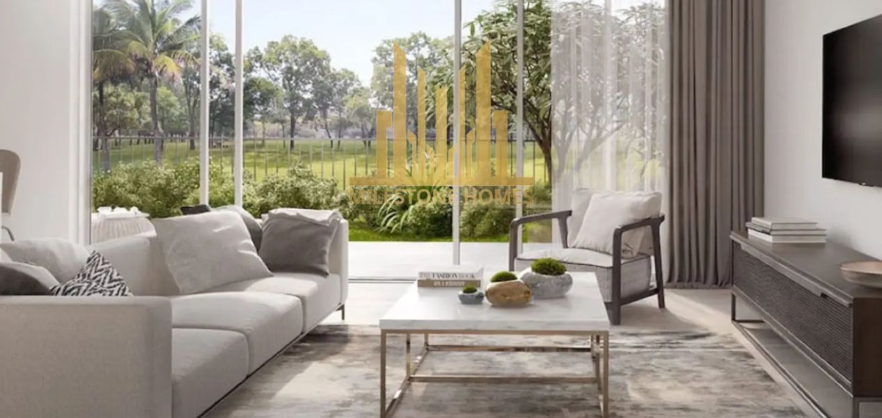 Bright living room with garden view at Camelia Villas Damac Hills