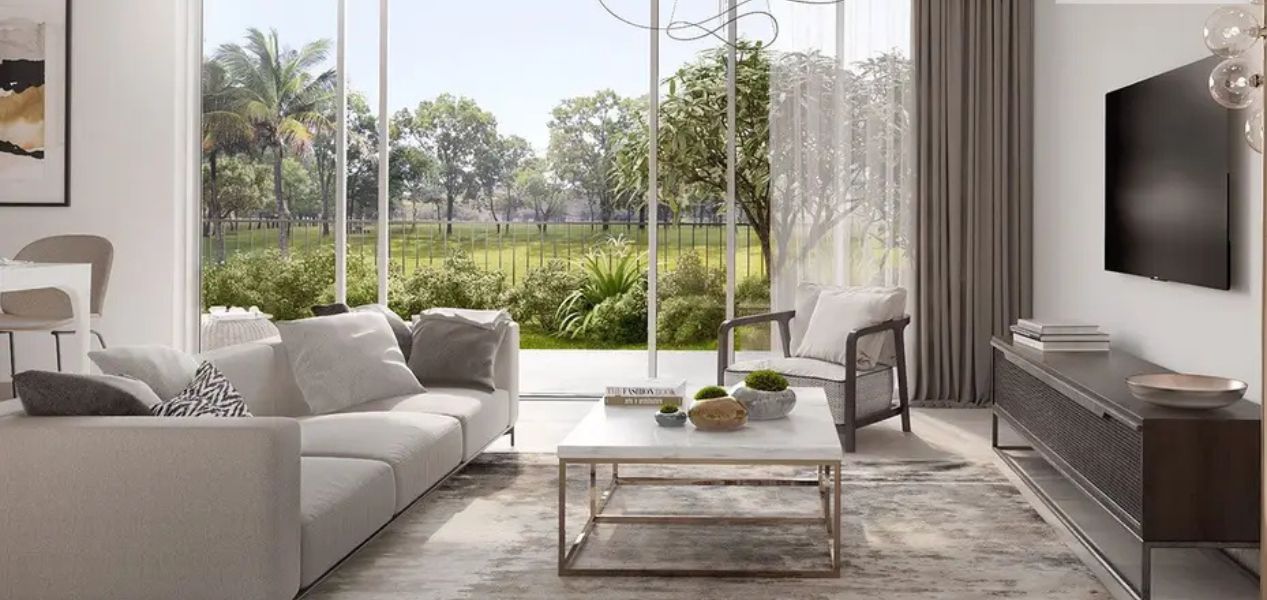 Spacious living room at Camelia Villas Damac Hills with garden view