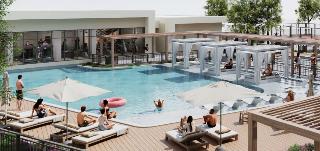 Large swimming pool and sun loungers at Beachfront Gates Expo City