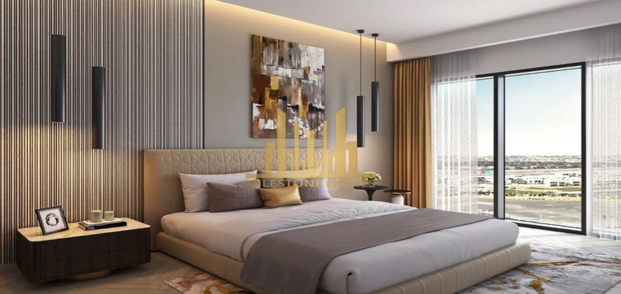 2‑bedroom Golf Greens apartment bedroom interior with large window overlooking golf Greens