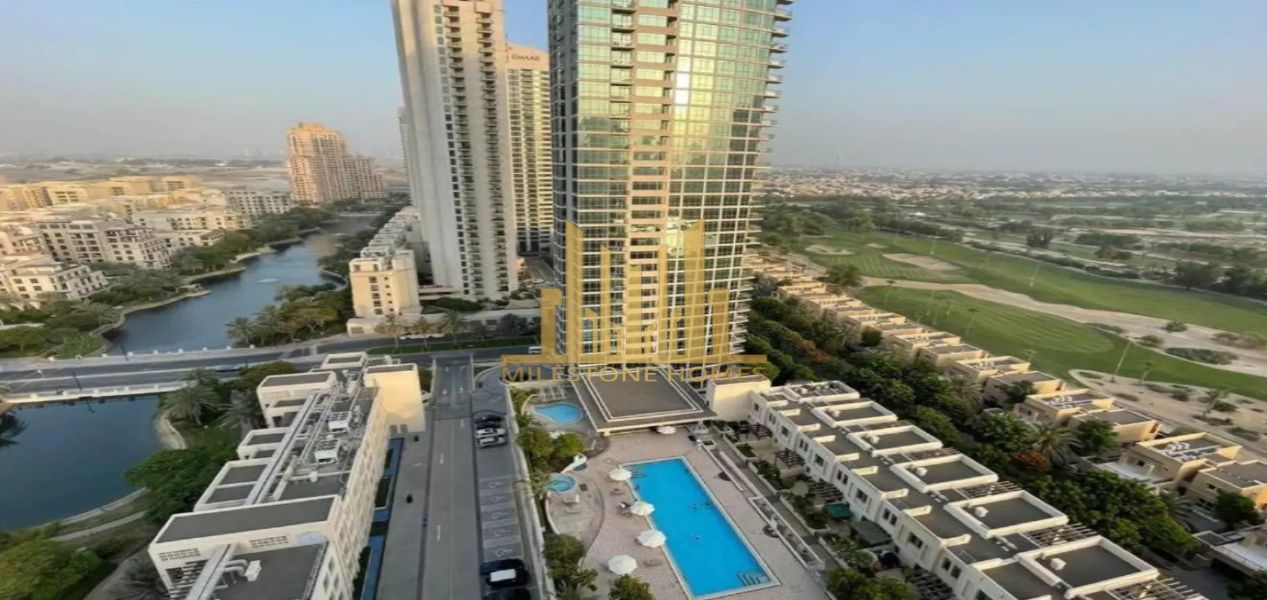 2‑bedroom Golf Greens apartment high‑rise tower with swimming pool and golf course views