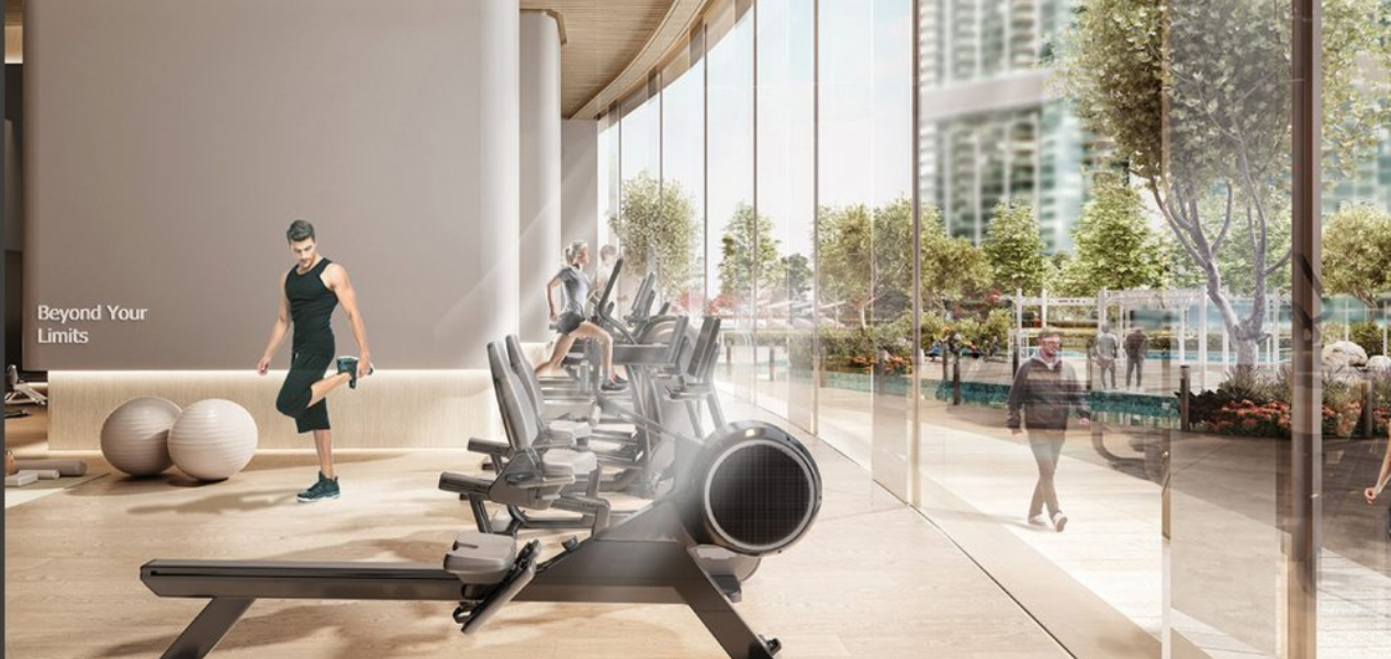 Modern fitness gym at Skyscape Aura Sobha Hartland with cardio equipment and panoramic garden views.