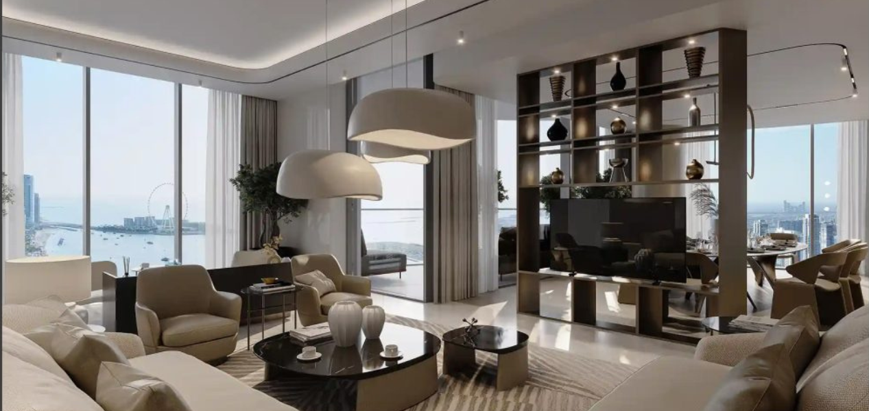 Luxury lounge with designer lighting and chic furniture overlooking water views at Skyscape Aura Sobha Hartland.