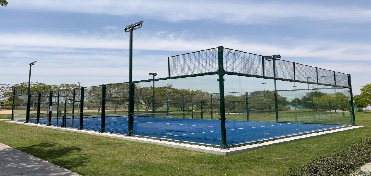 2‑bedroom Golf Greens apartment leisure padel court within landscaped grounds