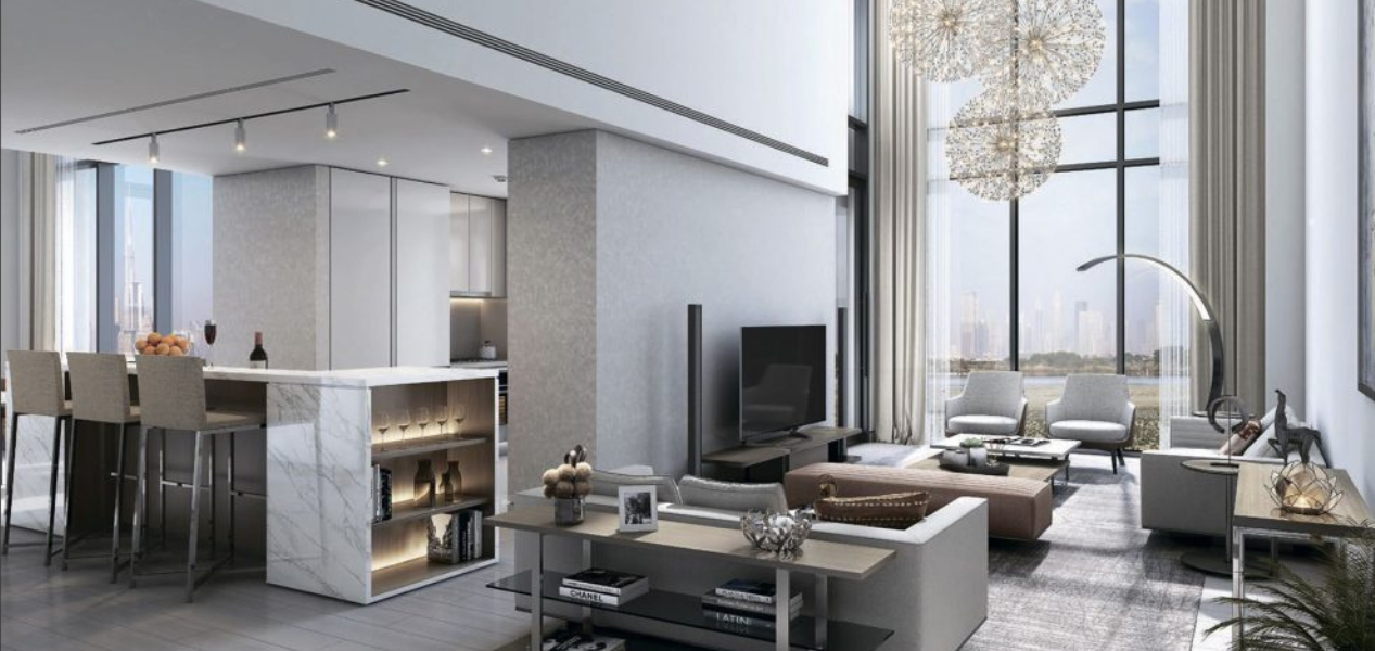 Bright open-plan living and kitchen space with floor-to-ceiling windows in Skyscape Aura Sobha Hartland residence.