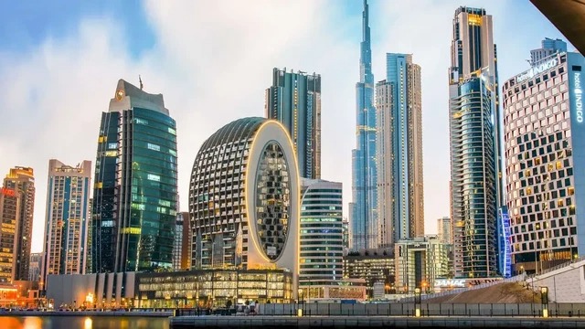 Modern skyline of properties in Business Bay, Dubai with canal and Burj Khalifa views