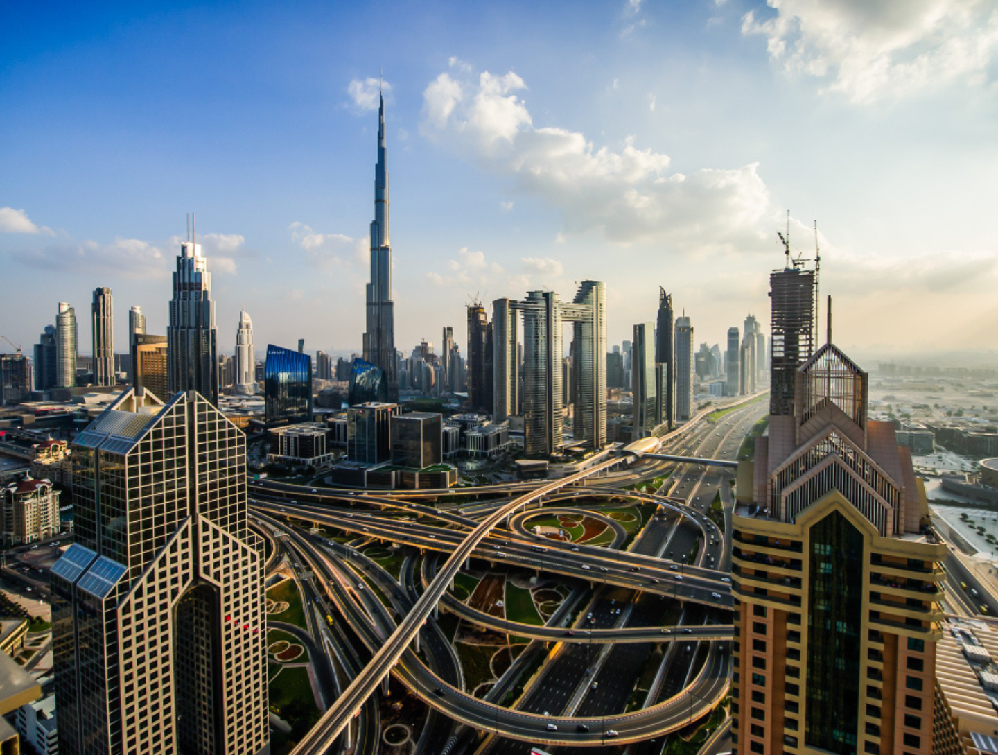 Avoid real estate scams Dubai with due diligence, shown in aerial view of Dubai properties