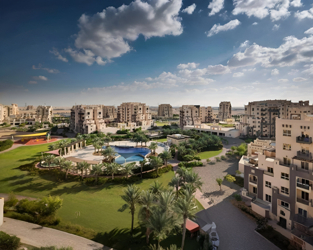 Aerial view of residential properties in Dubailand with landscaped gardens and family-friendly amenities