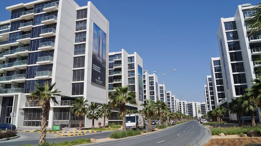 Modern residential properties in DAMAC Hills with landscaped surroundings and wide roads