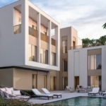 Private backyard with swimming pool at Sobha Elwood Dubailand villas surrounded by greenery