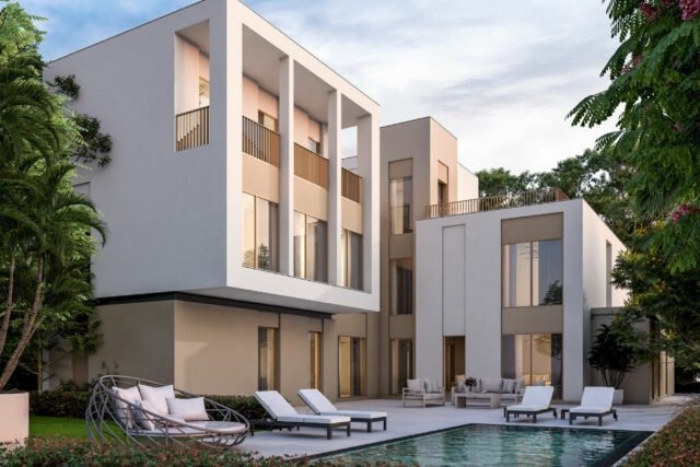 Private backyard with swimming pool at Sobha Elwood Dubailand villas surrounded by greenery
