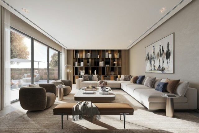 Spacious living area in Sobha Elwood Dubailand villas with elegant furniture and bookshelf