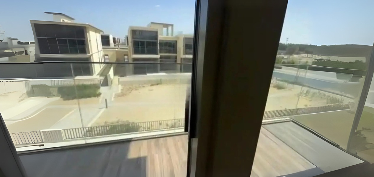 Balcony view overlooking modern villas in 5-Bed Villa Dubai Hills