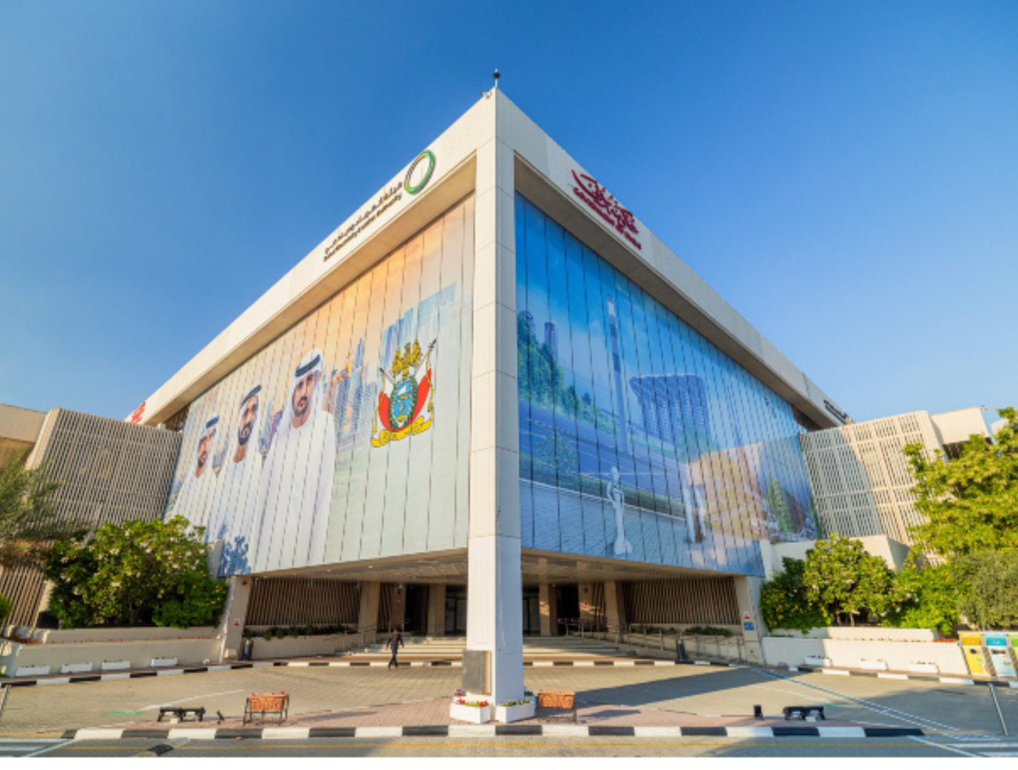 Front view of DEWA headquarters in Dubai under a clear blue sky, important for DEWA registration process