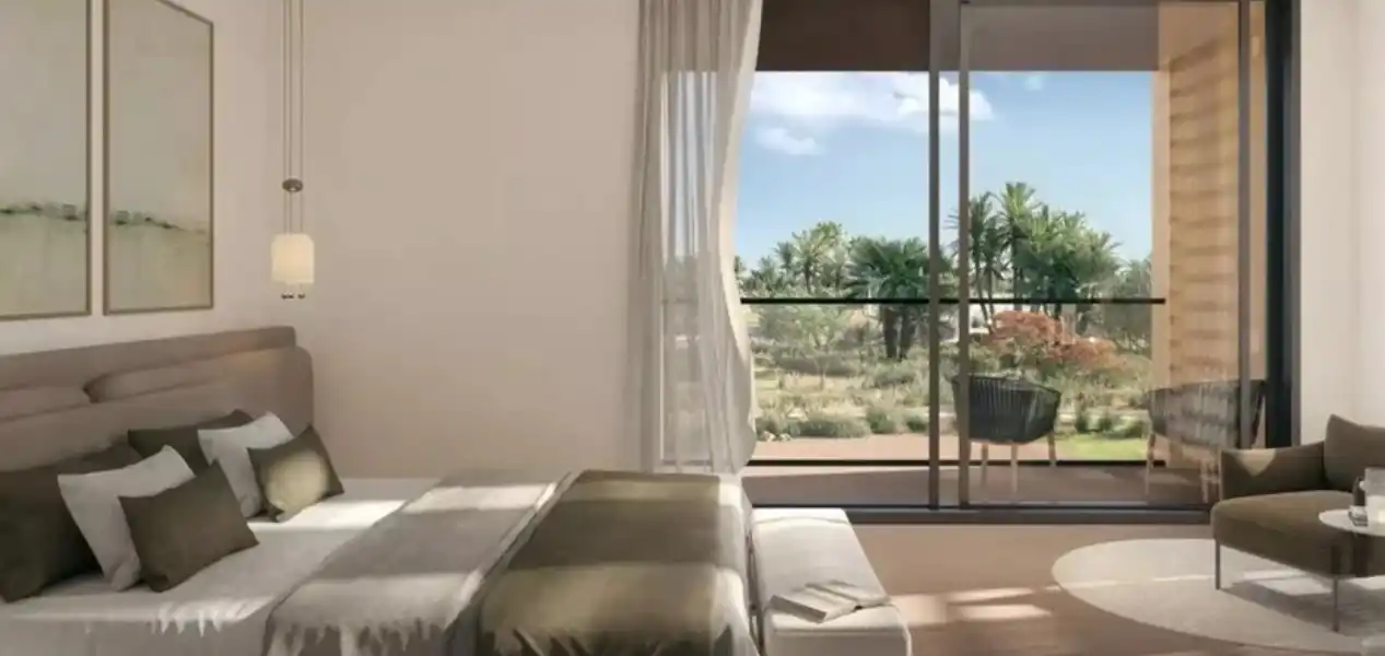 Modern bedroom at Rise By Athlon 4 Dubailand showcasing elegant design and natural light